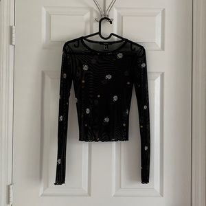 Cute seem thru long sleeve top. Size small.